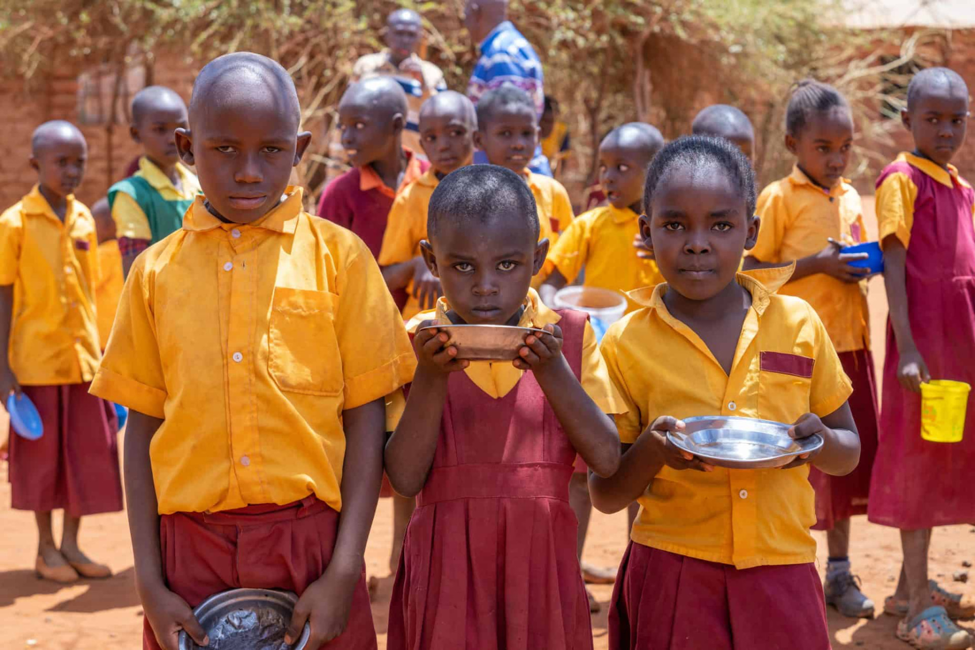 Children eating a meal outdoors in the Horn of Africa